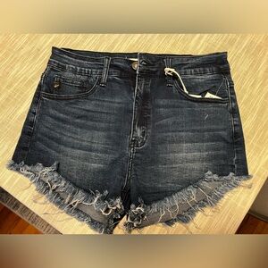 Jean shorts, shredded ends.